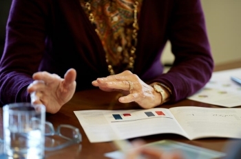 financial advisors hands at conference table